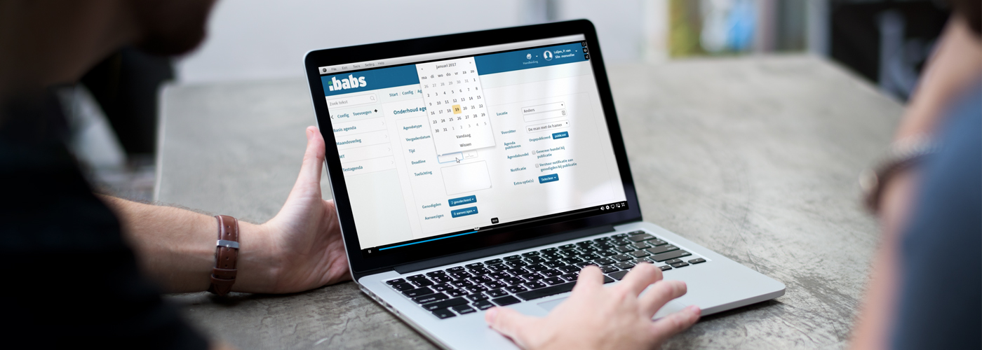 Laptop on which an instructional video is created by two people